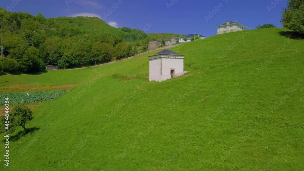 aerial view of a dovecote on a green field aerial view of a dovecote on a green field