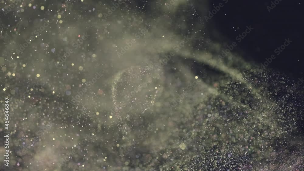 The sparkling particles falling in the air. slow motion