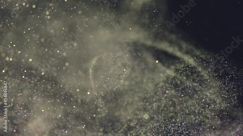 The sparkling particles falling in the air. slow motion