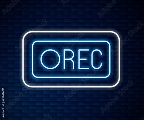 Glowing neon line Record button icon isolated on brick wall background. Rec button. Vector