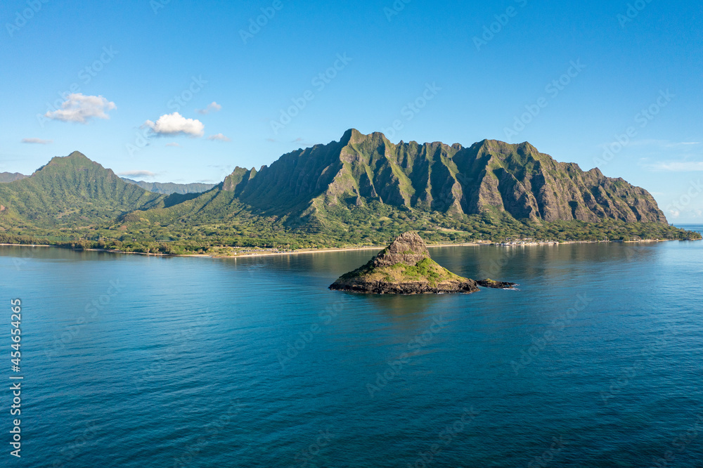Mokoli'i island in Oahu, Hawaii, with the Ko'olau mountain range