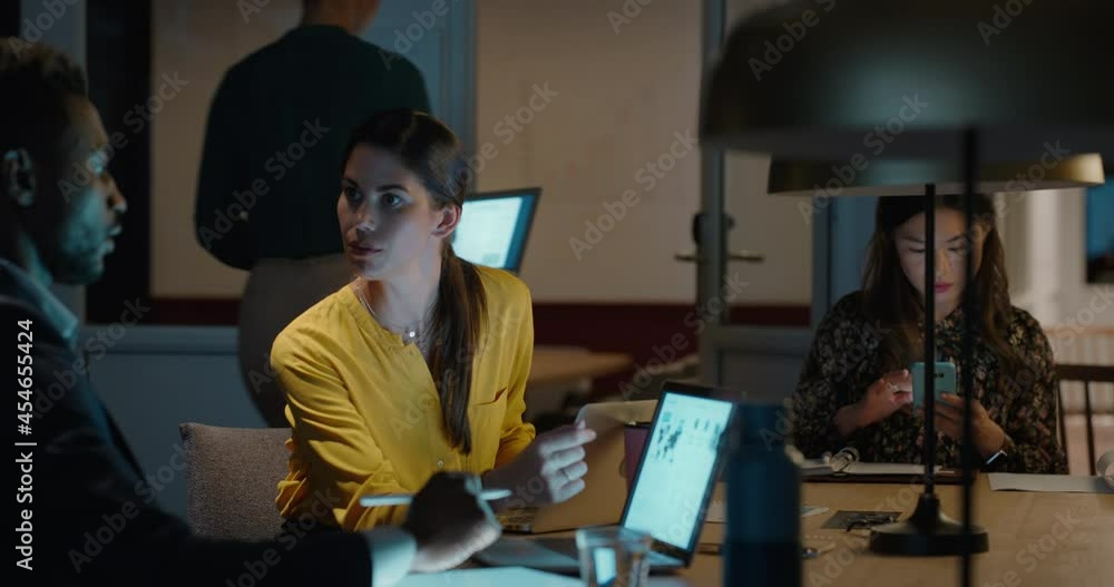 business people working late using laptop computer in office team leader woman discussing ideas with businessman colleagues brainstorming teamwork business people working late using laptop computer in office team leader woman discussing ideas with businessman colleagues brainstorming teamwork