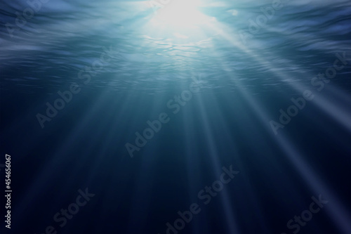 Rays of sun under water. The ocean is quiet.