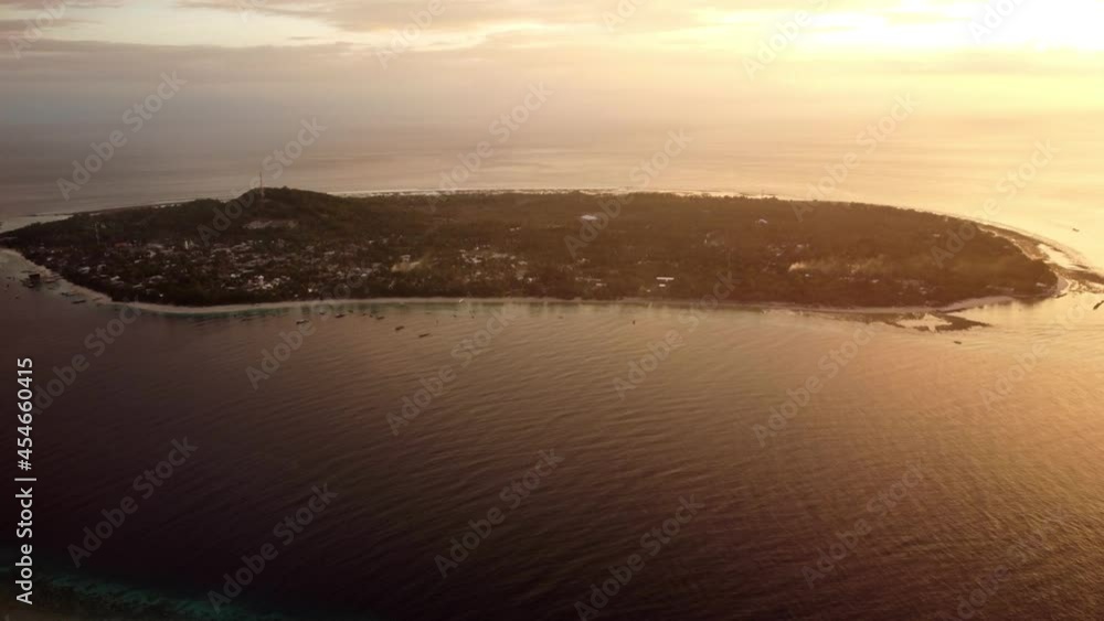 Aerial sunset isolated island in the ocean, tropical paradise Aerial sunset isolated island in the ocean, tropical paradise