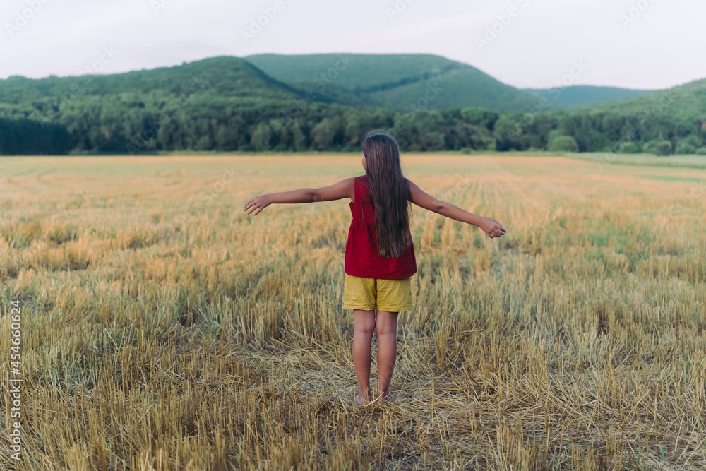 Side view portrait of happy beautiful girl breathing fresh air in field, outdoors. High quality photo Side view portrait of happy beautiful girl breathing fresh air in field, outdoors. High quality photo