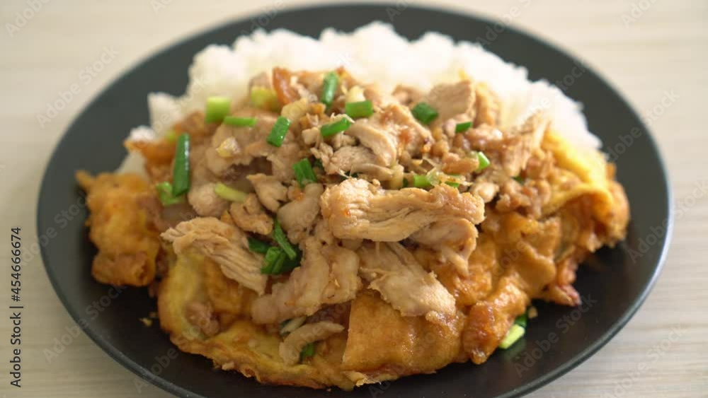 stir-fried pork with garlic and egg topped on rice - Asian food style stir-fried pork with garlic and egg topped on rice - Asian food style