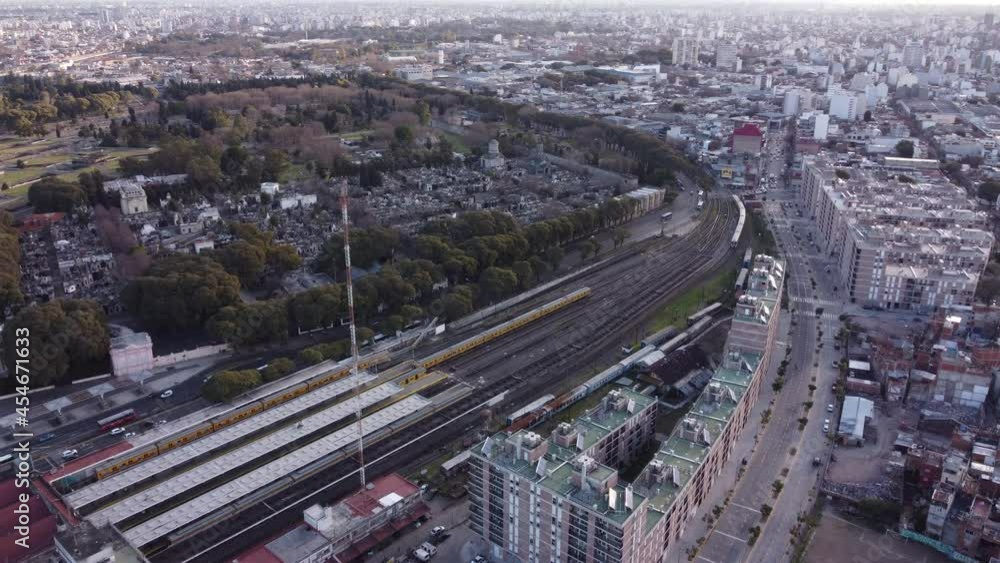 Aerial shot showing departing train leaving train station in Chacarita,Buenos Aires Aerial shot showing departing train leaving train station in Chacarita,Buenos Aires