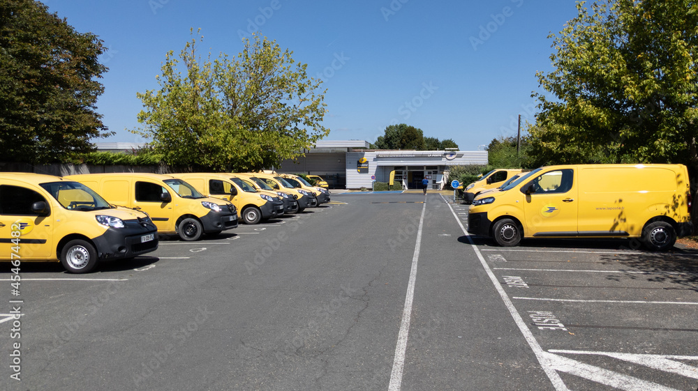 la poste yellow panel van car of a french post office in city france  libourne city Photos | Adobe Stock