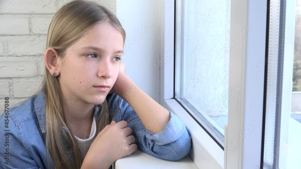 Sad Child Looking on Window, Unhappy Kid, Bored Thoughtful Girl, Teenager Face, Isolated People at Home in Coronavirus Crises Sad Child Looking on Window, Unhappy Kid, Bored Thoughtful Girl, Teenager Face, Isolated People at Home in Coronavirus Crises