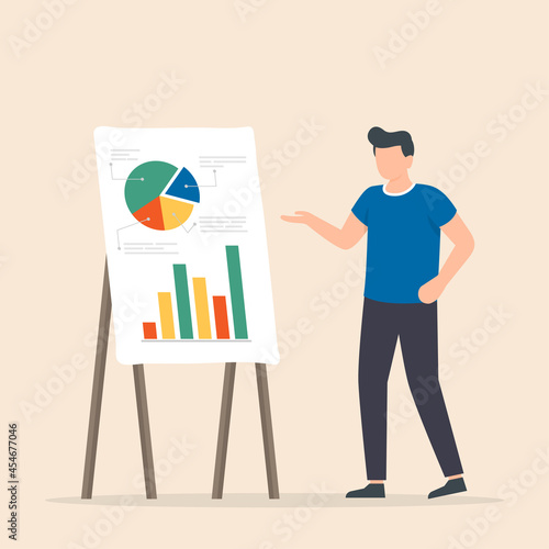 Young man standing near flip chart and pointing graph and diagram.