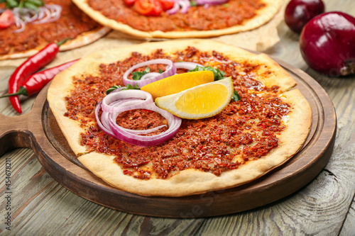 Delicious Turkish pizza on wooden background