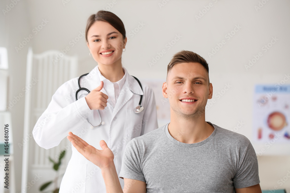 Happy young man and ophthalmologist in clinic Happy young man and ophthalmologist in clinic