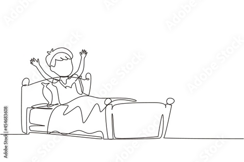 Single one line drawing little boy wake up and still yawning, still lying in bed under blanket. Sleepy child on bed in late weekend morning. Continuous line draw design graphic vector illustration