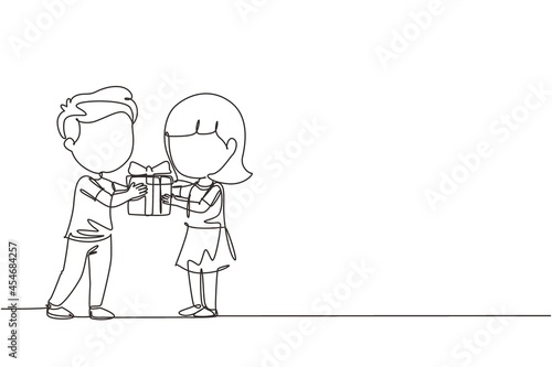 Single continuous line drawing boy kid giving girl birthday ribbon bow gift box. Children excited receiving gift from friend. Child hand over holiday present. One line draw graphic design vector