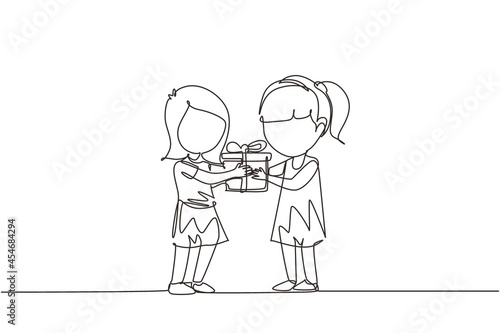 Single one line drawing girl giving her friend birthday ribbon bow gift box. Children excited receiving gift from friend. Child hand over holiday present. Continuous line draw design graphic vector