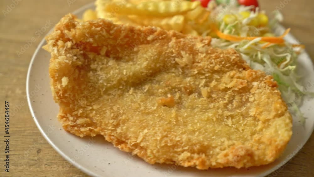 fried fish fillet and potatoes chips with mini salad fried fish fillet and potatoes chips with mini salad