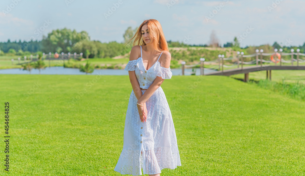 Lady in white cotton suit, crop top and skirt at nature, vacation scene Lady in white cotton suit, crop top and skirt at nature, vacation scene