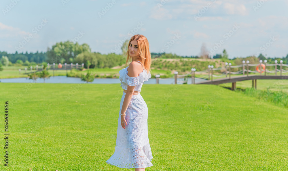 Lady in white cotton suit, crop top and skirt at nature, vacation scene Lady in white cotton suit, crop top and skirt at nature, vacation scene