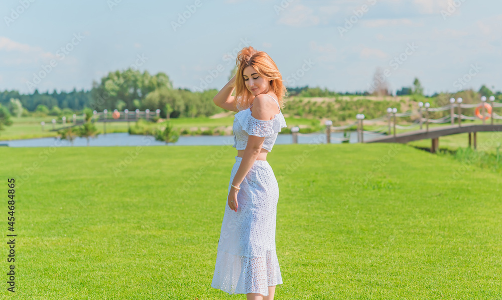 Lady in white cotton suit, crop top and skirt at nature, vacation scene Lady in white cotton suit, crop top and skirt at nature, vacation scene