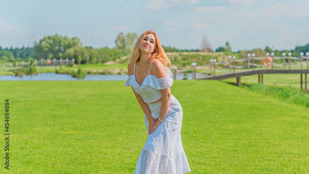 Lady in white cotton suit, crop top and skirt at nature, vacation scene Lady in white cotton suit, crop top and skirt at nature, vacation scene