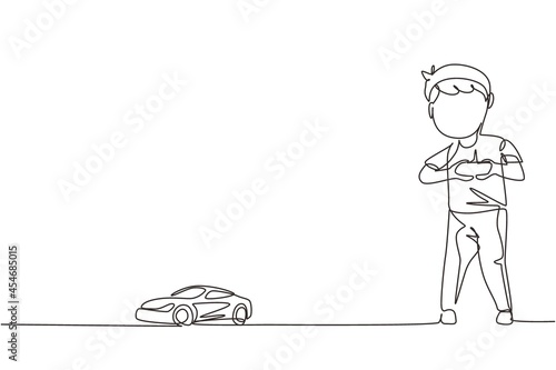 Single continuous line drawing little boy playing with remote-controlled car. Cute kids playing with electronic toy car with remote control in hands. One line draw graphic design vector illustration