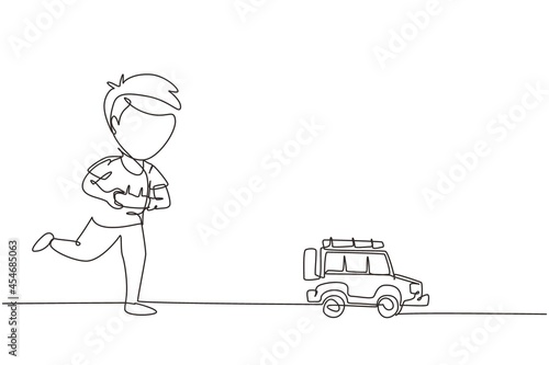 Continuous one line drawing boy playing with remote-controlled off road car. Cute kids playing with electronic toy car with remote control in hands. Single line draw design vector graphic illustration