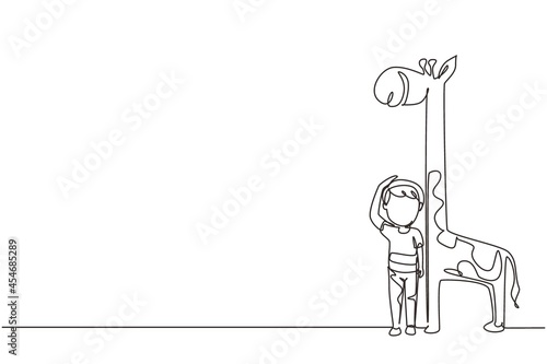Single continuous line drawing little boy measuring his height with giraffe height chart on wall. Kid measures growth. Child measuring height. Dynamic one line draw graphic design vector illustration