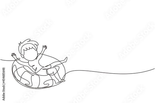 Single one line drawing little boy floating with lifebuoy with relax poses wearing beach and swimming attires. Kids feeling happy while using tire buoy. Continuous line draw design graphic vector