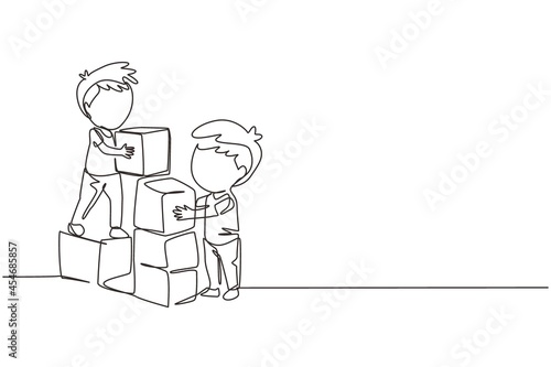 Single one line drawing two little boys playing blocks toys together. Educational toys. Children playing designer cubes, developmental constructor. Continuous line design graphic vector illustration