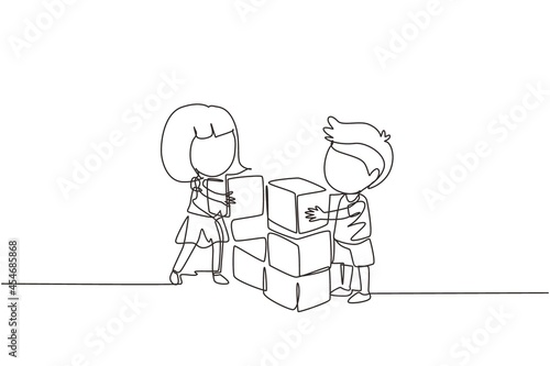 Single one line drawing little boy and girl playing blocks cube toys together. Kids play with toys brick. Educational toys. Children playing block cubes. Continuous line draw design graphic vector