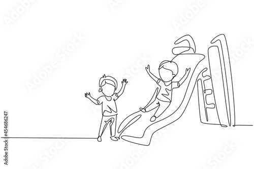 Continuous one line drawing smiling preschool boy sliding down slide and happy friend seeing him on side of slide. Kids playing together on playground. Single line design vector graphic illustration