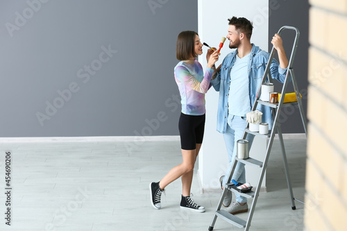 Young couple with paint bru...