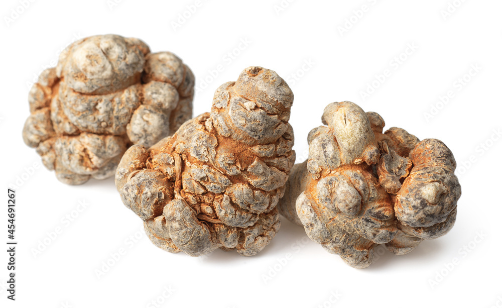 Three dried notoginseng roots isolated on white background Three dried notoginseng roots isolated on white background
