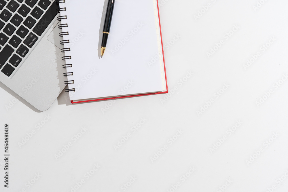 Flat lay, top view office white wooden table desk. Workspace with blank clip board, keyboard, office supplies,laptop,Notebook,pen,copy space on white background. Flat lay, top view office white wooden table desk. Workspace with blank clip board, keyboard, office supplies,laptop,Notebook,pen,copy space on white background.