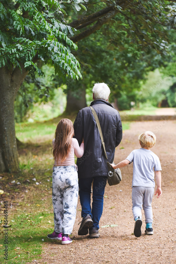 Grandparents with children on a day out for a walk Grandparents with children on a day out for a walk