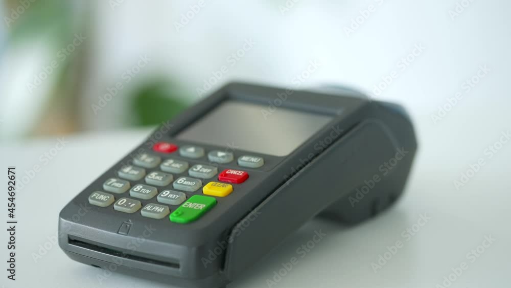 Contactless payment with smartphone. Wireless payment concept. Close-up, woman using smartphone cashless wallet NFC technology to pay order on bank terminal. Contactless payment with smartphone. Wireless payment concept. Close-up, woman using smartphone cashless wallet NFC technology to pay order on bank terminal.