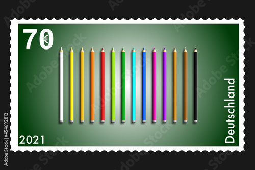 grüne 70 Cent Briefmarke mit Buntstiften photo