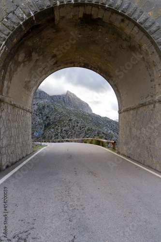 The road through the tunnel, with a mountain in the background