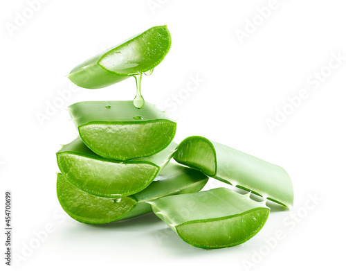 Aloe vera gel dripping on group of aloe vera slices
