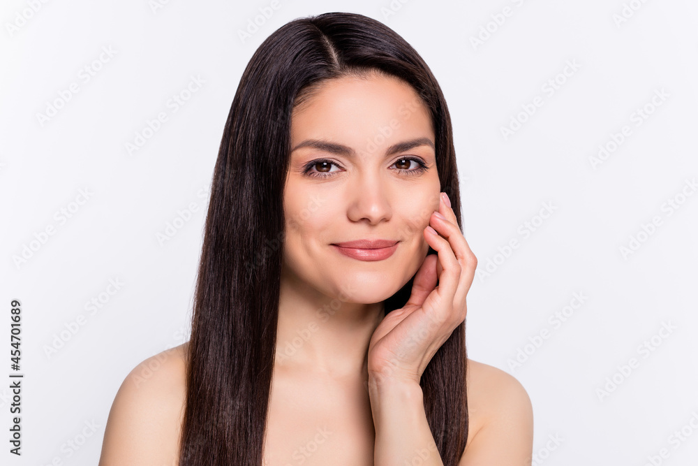 Photo portrait brunette woman smiling touching soft skin isolated white color background copyspace Photo portrait brunette woman smiling touching soft skin isolated white color background copyspace