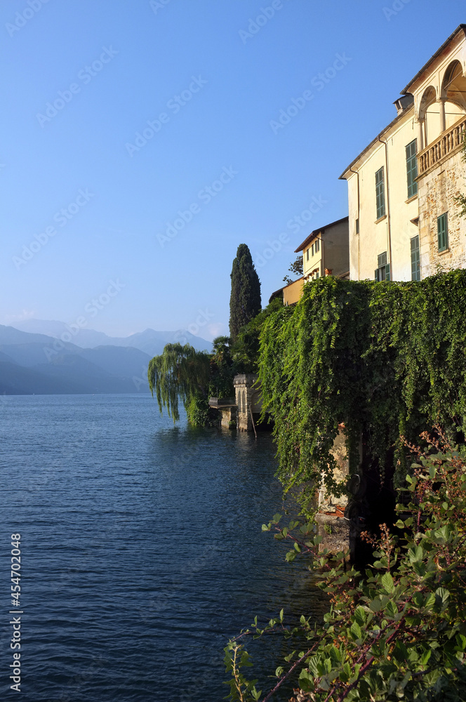Old houses overlook Orta Lake, in Piedmont, North-West Italy from the shores of San Giulio Island