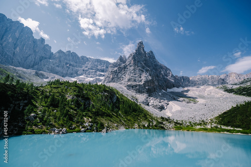 Morning with clear sky on Lago di Sorapis in the Italian Dolomites, milky blue lake Lago di Sorapis, Lake Sorapis, Dolomites, Italy.  photo