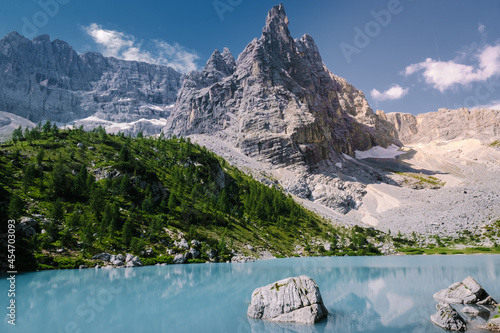 Morning with clear sky on Lago di Sorapis in the Italian Dolomites, milky blue lake Lago di Sorapis, Lake Sorapis, Dolomites, Italy.  photo