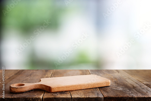 empty table board and defocused indoor background. product display concept