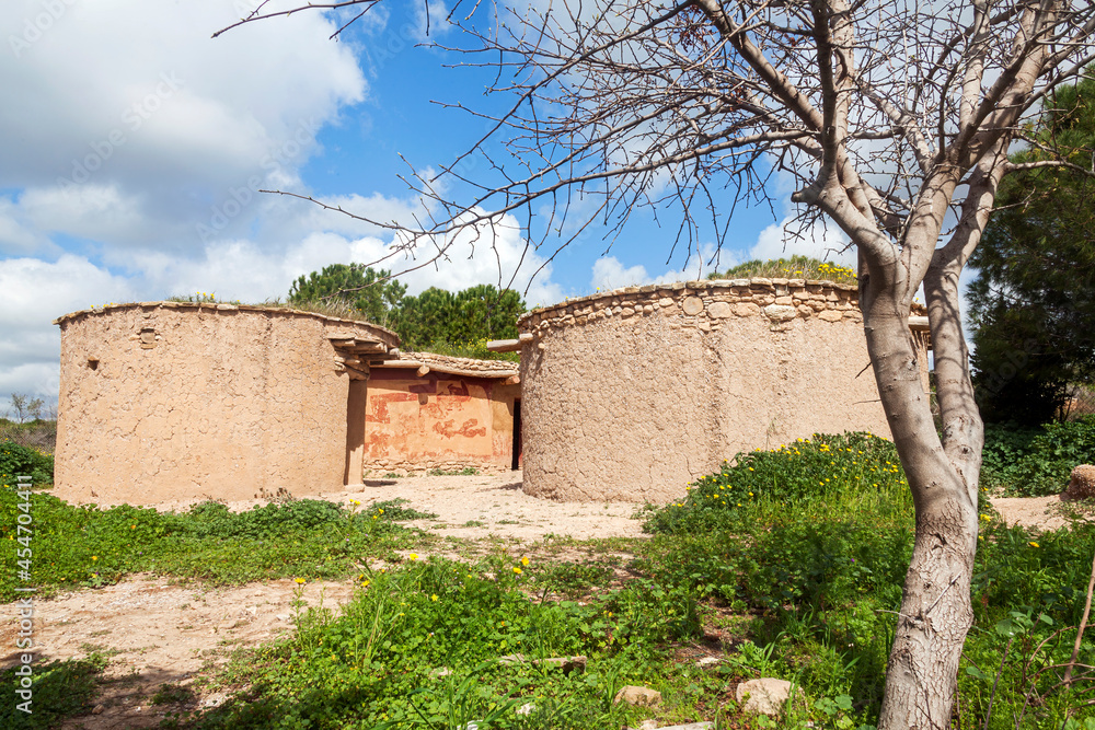 Reconstruction of houses of the Chalcolithic Period (Bronze Age) at Lempa Experimental Village Cyprus which is a popular tourist holiday travel destination and attraction landmark, stock photo image