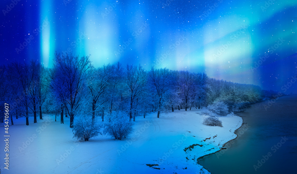 Northern lights or Aurora borealis in the sky in the forest on the river