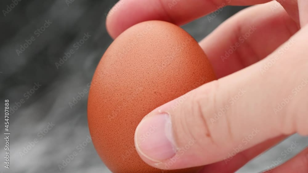 Video 4k and full HD of quality healthy organic egg with eggshell isolated on background. Video 4k and full HD of quality healthy organic egg with eggshell isolated on background.