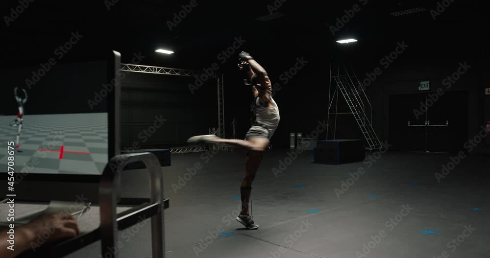 dancing man wearing motion capture suit in studio actor wearing mo-cap suit for 3d character animation for virtual reality technology dancing man wearing motion capture suit in studio actor wearing mo-cap suit for 3d character animation for virtual reality technology