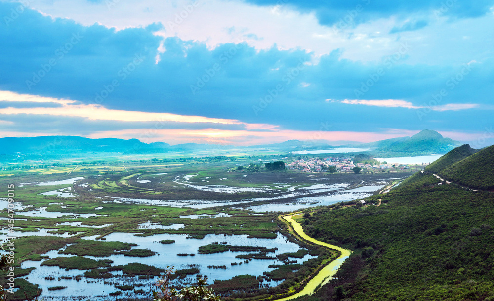 Fabulous beautiful magic dawn with small reservoirs and a yellow riveron the coast of the Ionian Sea in Greece. Amazing places.