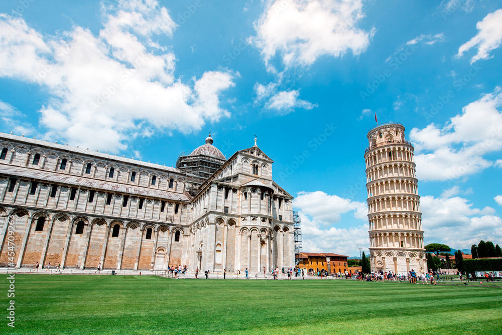 Picturesque landscape with cathedral or Duomo di Santa Maria Assunta near famous Leaning Tower in Pisa, Italy. fascinating exotic amazing places. Piazza dei Miracoli.